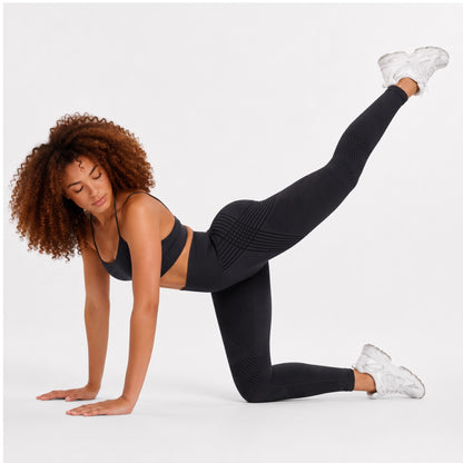 Woman wearing black anti-cellulite leggings